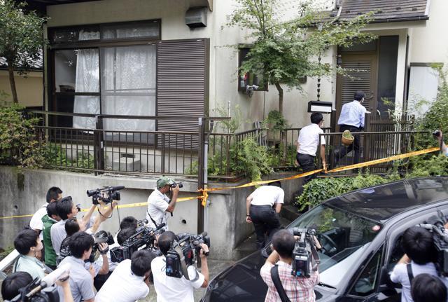 Police officers enter the house of Satoshi Uematsu, the suspect in a mass stabbing attack, in Sagamihara, outside of Tokyo on July 27, 2016. The suspect was being transferred from a local police station to the prosecutor's office in Yokohama. (AP Photo) Police officers enter the house of Satoshi Uematsu, the suspect in a mass stabbing attack, in Sagamihara, outside of Tokyo on July 27, 2016. The suspect was being transferred from a local police station to the prosecutor's office in Yokohama. (AP Photo)