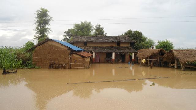 In this photograph taken on Tuesday, floodwaters surround a dwelling in Bardiya, 400 km southwest of Kathmandu. (AFP) In this photograph taken on Tuesday, floodwaters surround a dwelling in Bardiya, 400 km southwest of Kathmandu. (AFP)