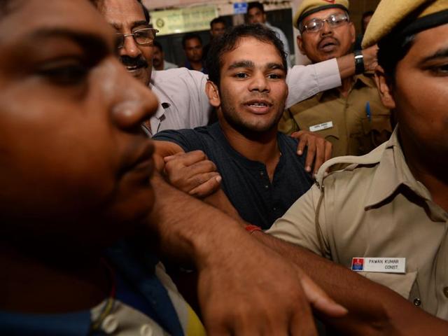 Narsingh Yadav (centre) arrives at the National Anti-Doping Agency office in New Delhi on Wednesday for hearing on his positive dope test.(AFP) Narsingh Yadav (centre) arrives at the National Anti-Doping Agency office in New Delhi on Wednesday for hearing on his positive dope test.(AFP)
