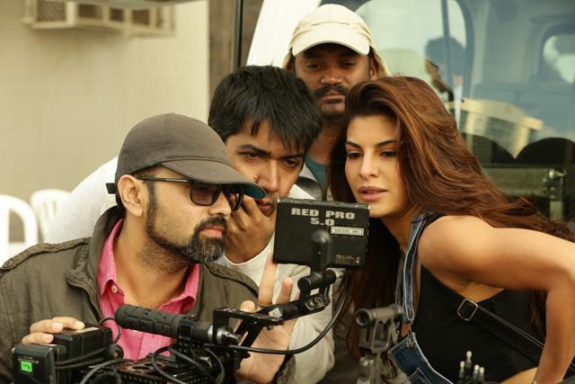 Jacqueline checks out the shots during helicopter sequence for Dishoom in ABu Dhabi.