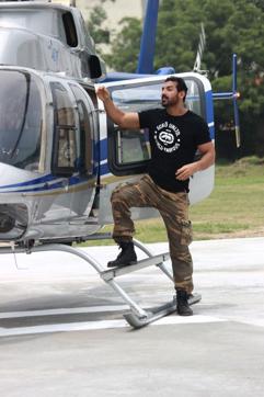 John Abraham boards the chopper.