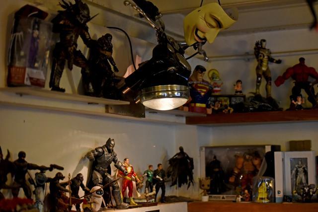 The studio is packed with comic figurines, upcycled objects (tarpaulin used to make a clock, masks made using discarded paper) (Photo: Pratik Chorge/HT)