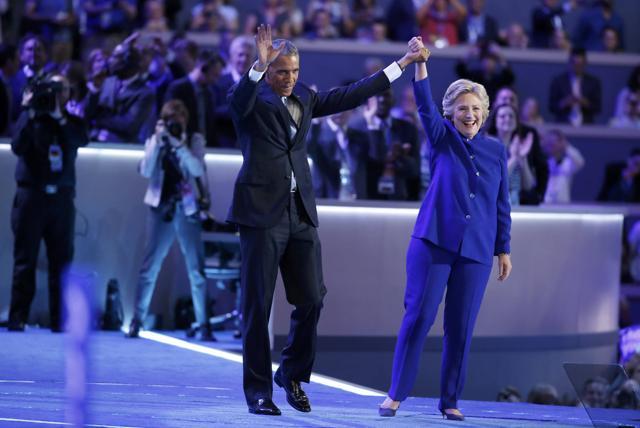 Democratic presidential nominee Hillary Clinton joins President Barack Obama after his speech at the Democratic National Convention in Philadelphia, Pennsylvania. (REUTERS)