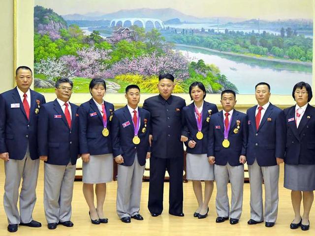 (FILES) This file picture taken by North Korea's official Korean Central News Agency on October 29, 2012 shows North Korean leader Kim Jong-Un (C) posing with Olympic gold medallists after he watched the football final between the April 25 and Sonbong sports teams at the 12th People's Sports Contest of North Korea at Kim Il-Sung Stadium in Pyongyang. (AFP)