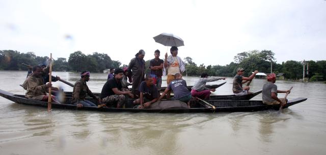 Wildlife officials and volunteers transport an injured baby rhino in the Sildubi area of Bagori forest range of Kaziranga. (AFP) Wildlife officials and volunteers transport an injured baby rhino in the Sildubi area of Bagori forest range of Kaziranga. (AFP)