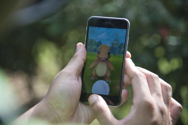 A Pokemon Go player attempts to catch Charmander, one of Pokemon's most iconic creature in New Delhi. (AP Photo) A Pokemon Go player attempts to catch Charmander, one of Pokemon's most iconic creature in New Delhi. (AP Photo)