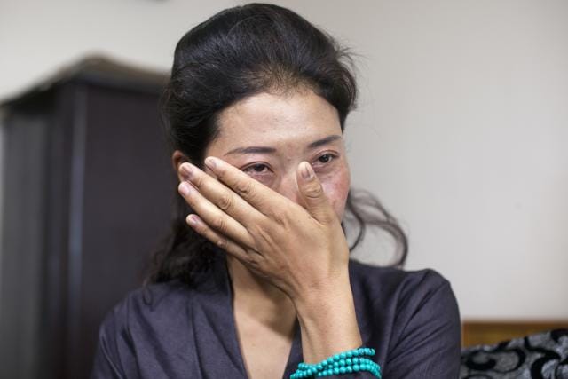 Nyima Lhamo, 26, wipes a tear as she talks about her uncle Tenzin Delek Rinpoche, a prominent Tibetan religious leader who died in prison last year. (AP) Nyima Lhamo, 26, wipes a tear as she talks about her uncle Tenzin Delek Rinpoche, a prominent Tibetan religious leader who died in prison last year. (AP)
