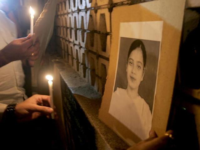 A file photo of demonstrators holding a candlelight vigil for Ishrat Jahan.