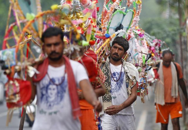 Kawariyas carrying holy water of Ganga River at Dhaula Kuan in New Delhi, India, on Wednesday, July 27, 2016. (Sanchit Khanna/HT PHOTO) Kawariyas carrying holy water of Ganga River at Dhaula Kuan in New Delhi, India, on Wednesday, July 27, 2016. (Sanchit Khanna/HT PHOTO)
