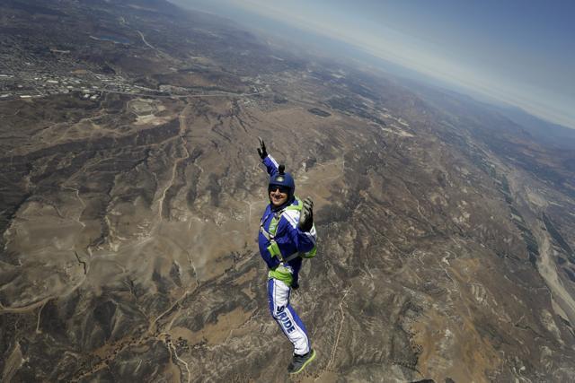 Skydiver Luke Aikins smiles as he jumps from a helicopter during his training in Simi Valley, California. (AP Photo) Skydiver Luke Aikins smiles as he jumps from a helicopter during his training in Simi Valley, California. (AP Photo)