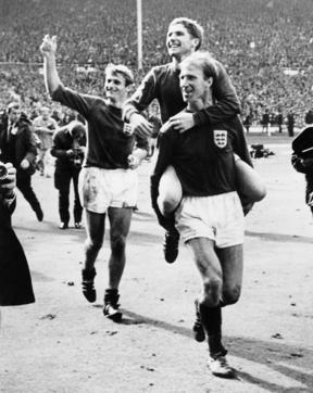 English defender Jackie Charlton carries his teammate midfielder Alan Ball, with forward Roger Hunt smiling behind, as they celebrate their team's victory over West Germany. (AFP) English defender Jackie Charlton carries his teammate midfielder Alan Ball, with forward Roger Hunt smiling behind, as they celebrate their team's victory over West Germany. (AFP)