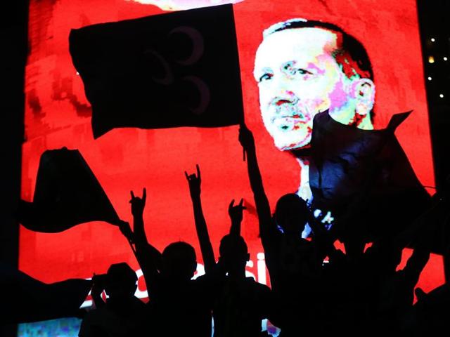 A man holds a banner as he and others have gathered in solidarity night after night since the July 15 coup attempt in central Ankara, Turkey. (Reuters) A man holds a banner as he and others have gathered in solidarity night after night since the July 15 coup attempt in central Ankara, Turkey. (Reuters)