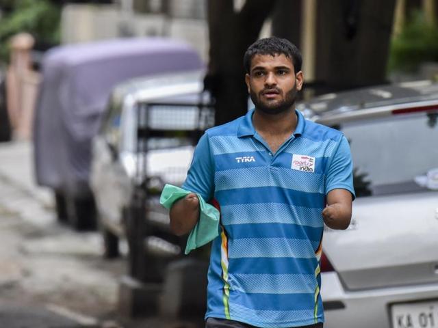 Jadhav is currently in Bangalore training and shopping (seen in pic) for the event.  Far from his hometown Solapur, training is the only thing on his mind, he says. “I started swimming at a young age. Both my hands had to be amputated after the accident. My father was a national swimmer and wanted me to be a swimmer too. I started swimming in 2007,” says Jadhav. (KUNAL PATIL/HT) 