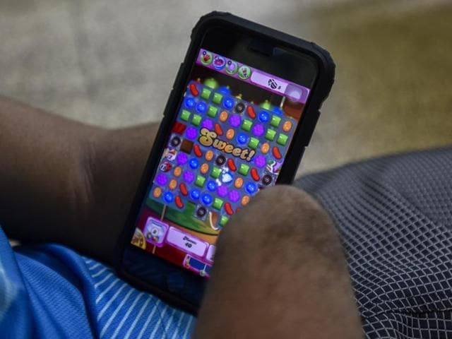 After the rigorous training, Jadhav plays a game on his mobile phone. “Disability is a matter of perception. It won't stop you from doing the things you enjoy doing,” says Jadhav. (KUNAL PATIL/HT) 