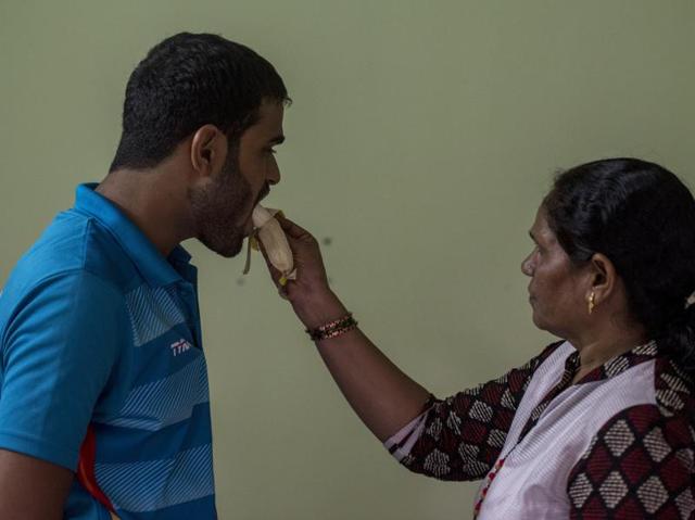Jadhav with his mother Savita Narayan at their rented home in Bangalore. ”A mother always understands her child’s dreams,” he says. (KUNAL PATIL/HT) 