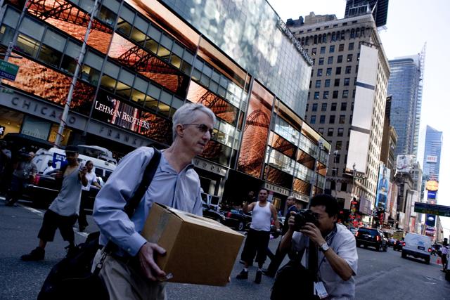 An employee leaving the headquarters of Lehman Brothers, shortly after the American investment bank went bankrupt on September 15, 2008. (Paris Match via Getty Images) An employee leaving the headquarters of Lehman Brothers, shortly after the American investment bank went bankrupt on September 15, 2008. (Paris Match via Getty Images)