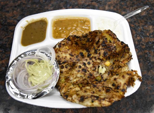 A variety of naans are on offer at Sanjay Chur Chur Naan at the Moolchand Metro Station. (Mohd Zakir/HT Photo) A variety of naans are on offer at Sanjay Chur Chur Naan at the Moolchand Metro Station. (Mohd Zakir/HT Photo)
