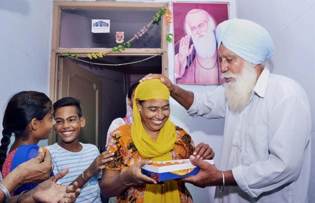 Kulwinder Kaur and her children celebrate in Nakodar, Jalandhar, after Kulwinder’s husband Gurdeep Singh was saved from execution in Indonesia. (PTI) Kulwinder Kaur and her children celebrate in Nakodar, Jalandhar, after Kulwinder’s husband Gurdeep Singh was saved from execution in Indonesia. (PTI)