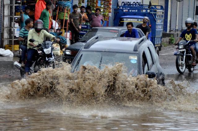 A car wades through a heavily flooded service lane near Hero Honda chowk in Gurgaon, on July 12, 2015. (Chinmaya Sharma/ HT File Photo) A car wades through a heavily flooded service lane near Hero Honda chowk in Gurgaon, on July 12, 2015. (Chinmaya Sharma/ HT File Photo)