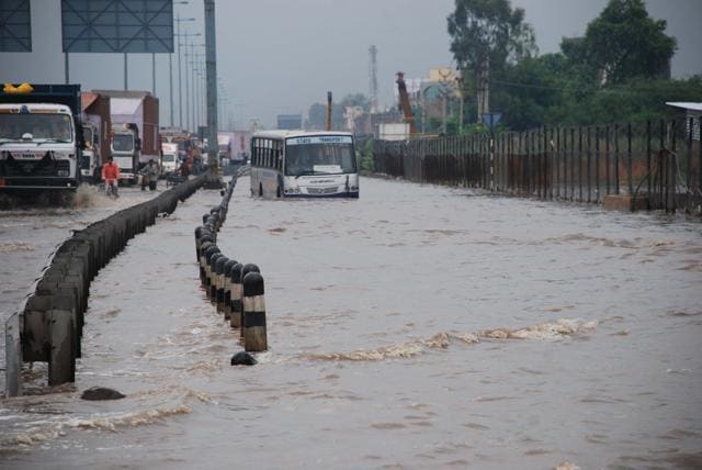 An inter-state bus wades through knee-deep water on a service lane at the Hero Honda chowk in Gurgaon, on July 20, 2010. (Manoj Kumar/ HT File Photo) An inter-state bus wades through knee-deep water on a service lane at the Hero Honda chowk in Gurgaon, on July 20, 2010. (Manoj Kumar/ HT File Photo)