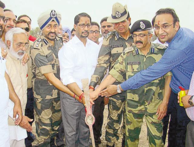 Punjab local bodies minister Anil Joshi (centre) with BSF DIG Sumer Singh (third from right), Amritsar Improvement Trust Chairman Sandeep Rishi (right) and others, laying the foundation stone for the project to hoist the highest Tricolour at Attari border in Amritsar.(HT File) Punjab local bodies minister Anil Joshi (centre) with BSF DIG Sumer Singh (third from right), Amritsar Improvement Trust Chairman Sandeep Rishi (right) and others, laying the foundation stone for the project to hoist the highest Tricolour at Attari border in Amritsar.(HT File)