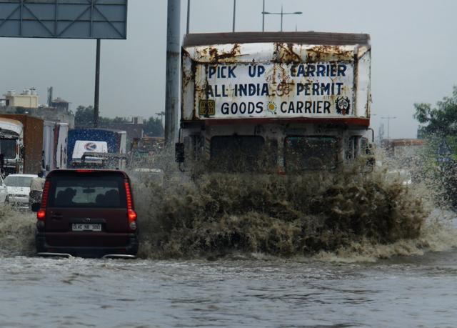 A truck creates a massive splash as it struggles to navigate a heavily flood road at the Hero Honda chowk in Gurgaon, September 04, 2012. (Manoj Kumar/ HT File Photo) A truck creates a massive splash as it struggles to navigate a heavily flood road at the Hero Honda chowk in Gurgaon, September 04, 2012. (Manoj Kumar/ HT File Photo)