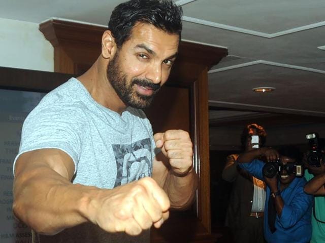 John Abraham poses for the shutterbugs in Mumbai on July 28. (AFP) John Abraham poses for the shutterbugs in Mumbai on July 28. (AFP)