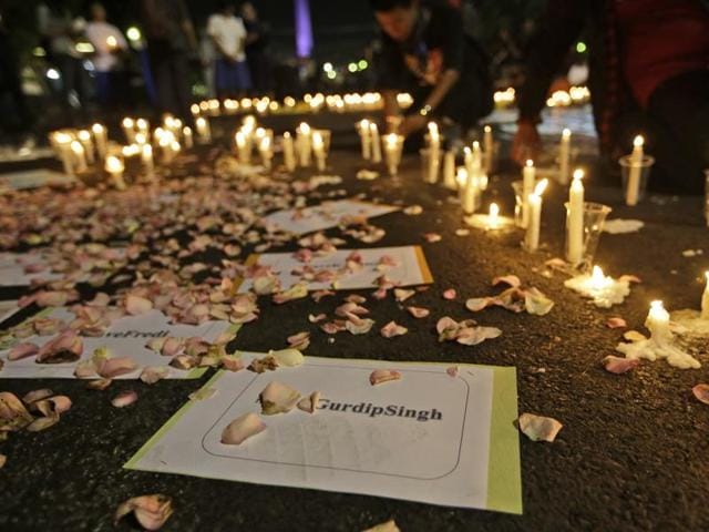 Activists light candles around posters with the names of death row inmates awaiting executions, including that of India’s Gurdip Singh, during a vigil against death penalty outside ‘the presidential palace in Jakarta. (AP) Activists light candles around posters with the names of death row inmates awaiting executions, including that of India’s Gurdip Singh, during a vigil against death penalty outside ‘the presidential palace in Jakarta. (AP)