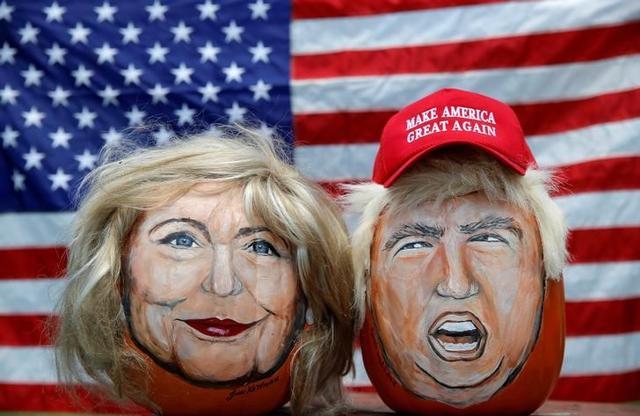 The images of US Democratic presidential candidate Hillary Clinton (left) and Republican presidential candidate Donald Trump are seen painted on decorative pumpkins created by artist John Kettman in LaSalle, Illinois. (Reuters Photo) The images of US Democratic presidential candidate Hillary Clinton (left) and Republican presidential candidate Donald Trump are seen painted on decorative pumpkins created by artist John Kettman in LaSalle, Illinois. (Reuters Photo)