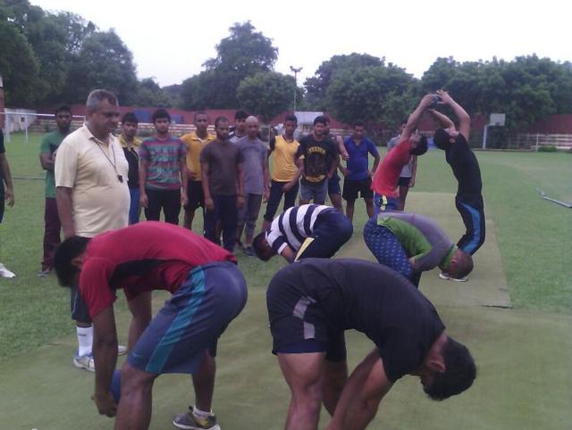 Rustam Khan (left) watching athletes being trained in Allahabad.(HT PHOTO)