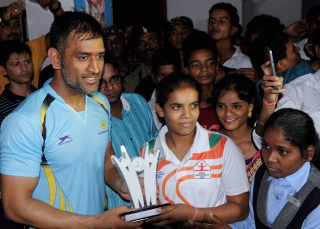 Indian Skipper Mahendra Singh Dhoni felicitates Gold Medalists Indian Archer players during a programme players at Silli. (PTI Photo) Indian Skipper Mahendra Singh Dhoni felicitates Gold Medalists Indian Archer players during a programme players at Silli. (PTI Photo)