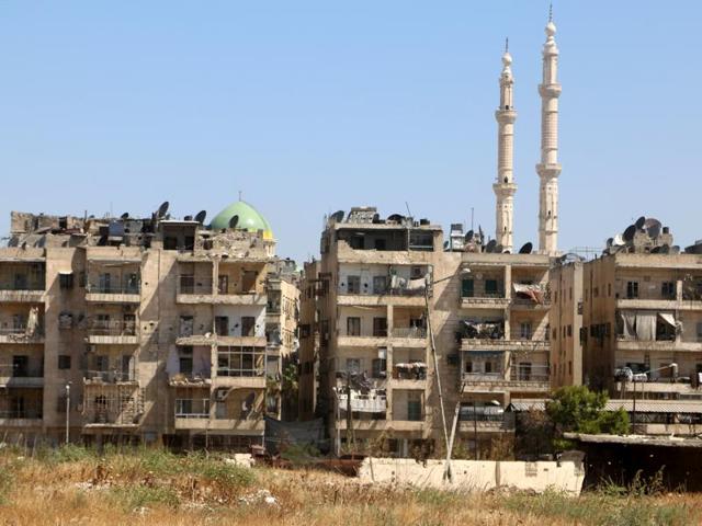 Buildings are seen near the road, which was believed to be used by civilians to access one of the safe exit points opened for civilians intending to leave rebel-held areas, in Aleppo's Bustan al Qasr, Syria. (Reuters Photo) Buildings are seen near the road, which was believed to be used by civilians to access one of the safe exit points opened for civilians intending to leave rebel-held areas, in Aleppo's Bustan al Qasr, Syria. (Reuters Photo)