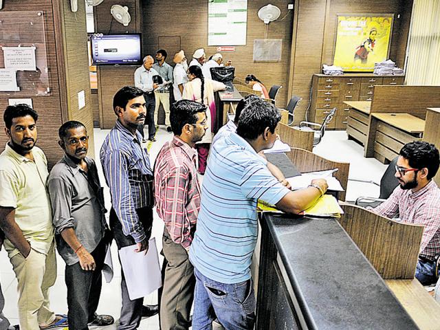 Residents at the income tax office in Sector 17, Chandigarh, on Friday.(Karun Sharma/HT) Residents at the income tax office in Sector 17, Chandigarh, on Friday.(Karun Sharma/HT)