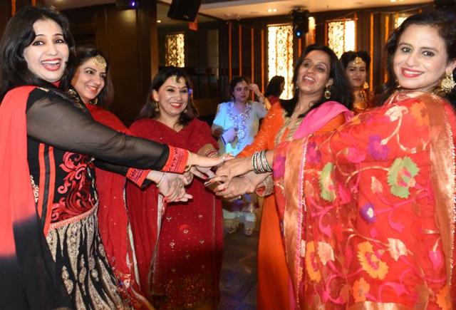 Celebrating Teej at a get-together in Sector 43, Chandigarh, on Saturday. Teej is a collective name for monsoon festivals, observed particularly in western and northern states of India and Nepal. (Sanjeev Sharma/HT Photo)