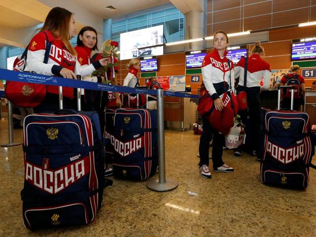 Russia's women's handball Olympic team members go through check-in before national team's departure. (Reuters Photo) Russia's women's handball Olympic team members go through check-in before national team's departure. (Reuters Photo)