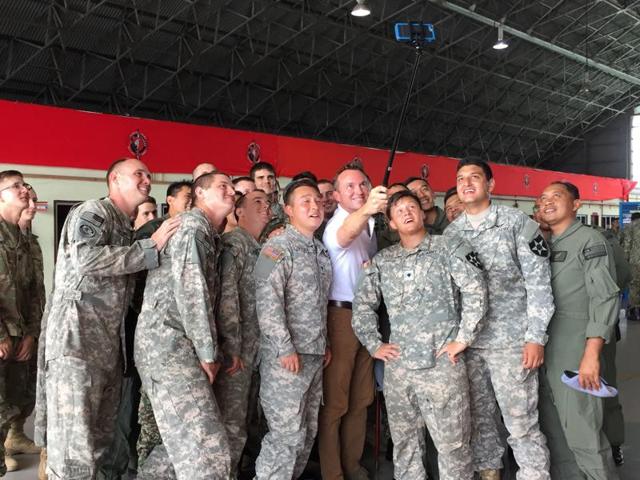 US army secretary Eric Fanning, fourth from right, takes a selfie with fellow personnel during an annual joint military exercise with the Malaysian army in Johor Bahru, Malaysia. (AP) US army secretary Eric Fanning, fourth from right, takes a selfie with fellow personnel during an annual joint military exercise with the Malaysian army in Johor Bahru, Malaysia. (AP)