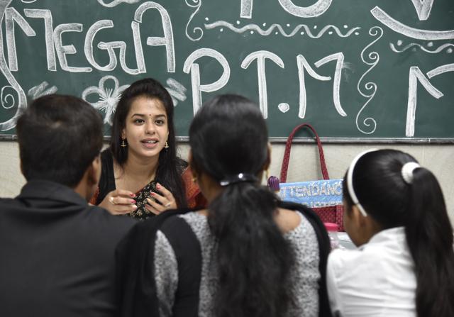 Government teachers interact with parents of school students in a school in Kalkaji. (S Burmaula / HT Photo) Government teachers interact with parents of school students in a school in Kalkaji. (S Burmaula / HT Photo)