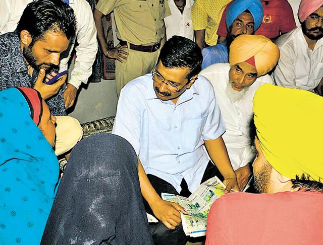 Delhi chief minister and national convener of Aam Aadmi Party Arvind Kejriwal with the Dalit family at Sukhera Bodla village in Jalalabad on Friday.(HT photo) Delhi chief minister and national convener of Aam Aadmi Party Arvind Kejriwal with the Dalit family at Sukhera Bodla village in Jalalabad on Friday.(HT photo)