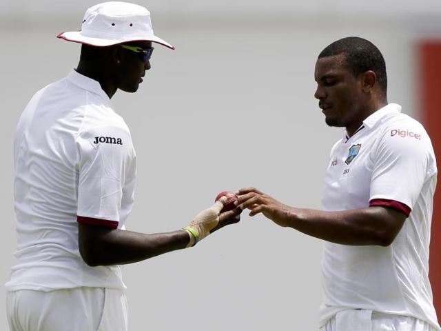 West Indies' captain Jason Holder, left, hand the ball to bowler Shannon Gabriel. (AP Photo) West Indies' captain Jason Holder, left, hand the ball to bowler Shannon Gabriel. (AP Photo)