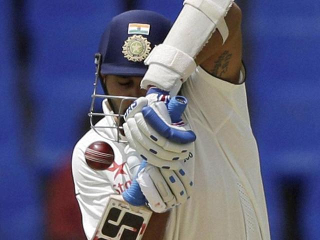 India's Murali Vijay plays a shot bowled by West Indies' Shannon Gabriel to be caught and dismissed.(AP Photo) India's Murali Vijay plays a shot bowled by West Indies' Shannon Gabriel to be caught and dismissed.(AP Photo)