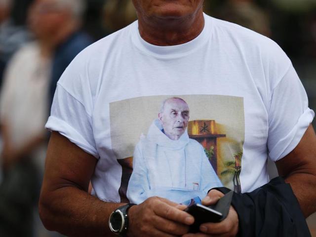 A man wears a tee-shirt with the portrait of French priest Jacques Hamel, who was killed in a church during a hostage-taking claimed by Islamic State group. (AFP) A man wears a tee-shirt with the portrait of French priest Jacques Hamel, who was killed in a church during a hostage-taking claimed by Islamic State group. (AFP)