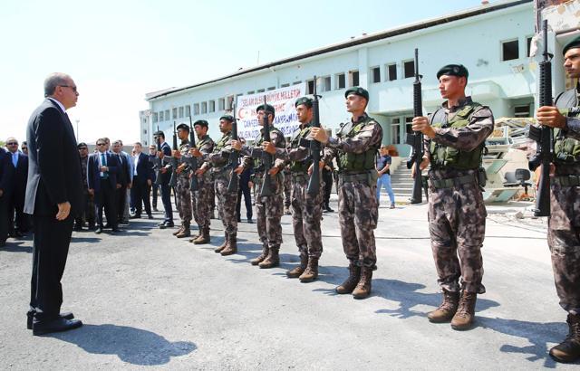 Turkish President Recep Tayyip Erdogan standing in front of guards during his visit to the Police Special Operation department's headquarters in Golbasi district of Ankara. (AFP) Turkish President Recep Tayyip Erdogan standing in front of guards during his visit to the Police Special Operation department's headquarters in Golbasi district of Ankara. (AFP)
