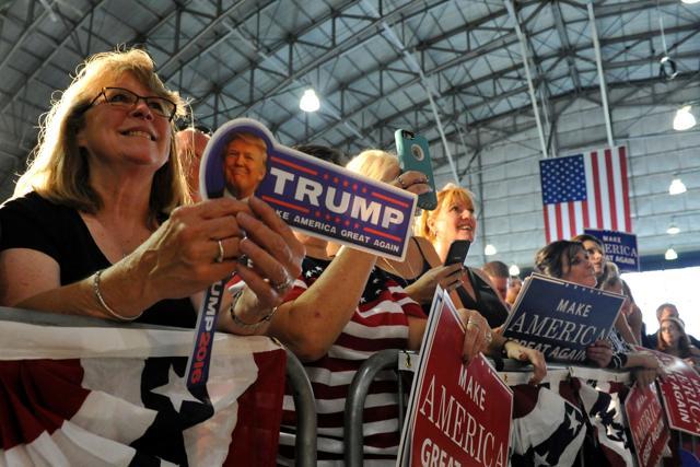 Supporters of Republican President candidate Donald Trump listen as he addresses the audience at the Wings Over the Rockies Air & Space Museum in Denver, Colorado. (AFP) Supporters of Republican President candidate Donald Trump listen as he addresses the audience at the Wings Over the Rockies Air & Space Museum in Denver, Colorado. (AFP)