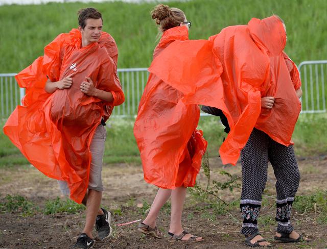 Pilgrims leave in a rain after the mass celebrated by Pope Francis at the end of the World Youth Day. (AFP) Pilgrims leave in a rain after the mass celebrated by Pope Francis at the end of the World Youth Day. (AFP)