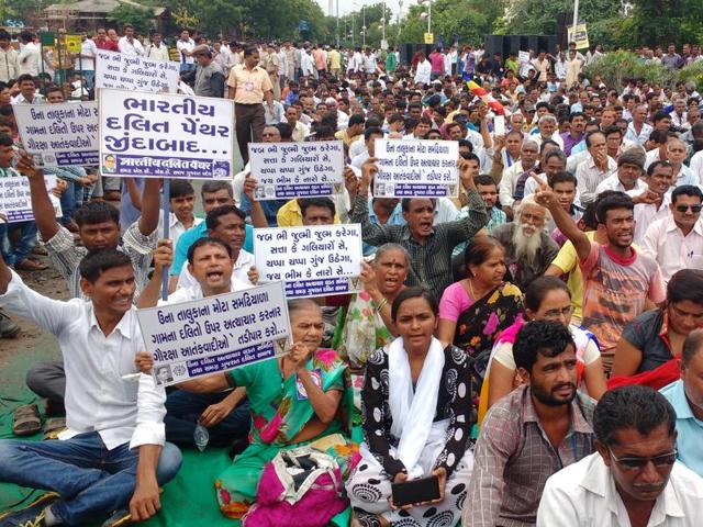 Dalit people from across Gujarat attend an Ahmedabad rally to protest against the attack on Dalit men in Una, on Friday.(Siddharaj Solanki/ HT Photo) Dalit people from across Gujarat attend an Ahmedabad rally to protest against the attack on Dalit men in Una, on Friday.(Siddharaj Solanki/ HT Photo)