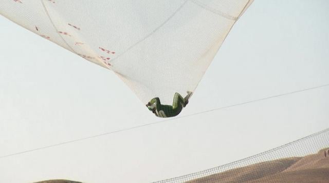 After a two-minute freefall, Aikins landed in the 100-by-100-foot net at the Big Sky movie ranch. (AP) After a two-minute freefall, Aikins landed in the 100-by-100-foot net at the Big Sky movie ranch. (AP)