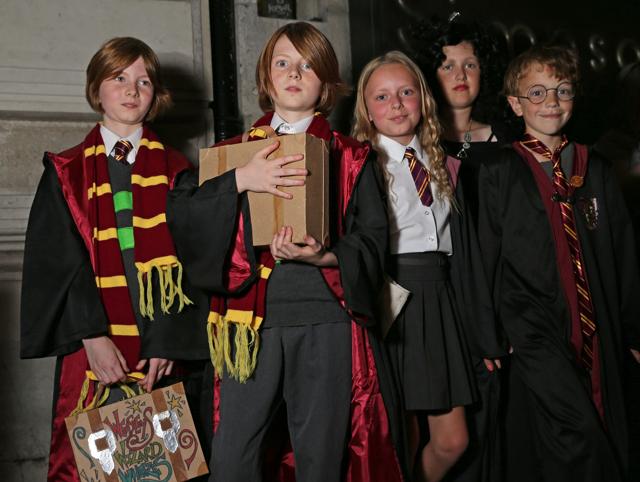 Children dressed as characters from Harry Potter books, pose for a photograph while waiting for their copy of the book in London. (AFP) Children dressed as characters from Harry Potter books, pose for a photograph while waiting for their copy of the book in London. (AFP)