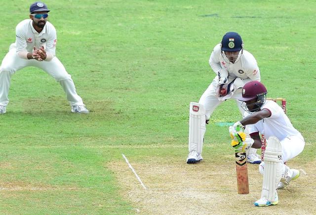 NARROW ESCAPE: Jermaine Blackwood misses a tricky delivery from R Ashwin which goes straight through to ’keeper Wriddhiman Saha. The off-spinner scalped the right-hander’s wicket with a lbw soon after (25th over). He went on to take five wickets, giving just 52 runs, as he ran through the West Indies middle-order. The hosts folded their innings at 196 in just the second session. (AFP) NARROW ESCAPE: Jermaine Blackwood misses a tricky delivery from R Ashwin which goes straight through to ’keeper Wriddhiman Saha. The off-spinner scalped the right-hander’s wicket with a lbw soon after (25th over). He went on to take five wickets, giving just 52 runs, as he ran through the West Indies middle-order. The hosts folded their innings at 196 in just the second session. (AFP)