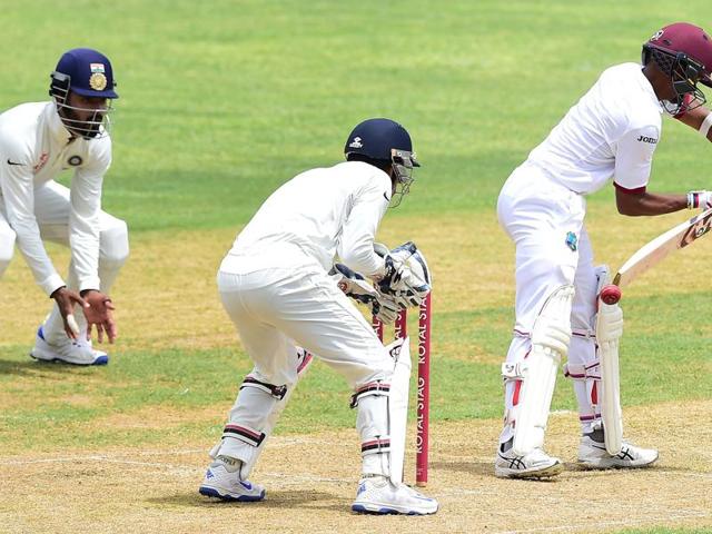 EDGY STUFF: Shane Dowrich edges an Ashwin delivery to Saha, who made no mistakes. The off-spinner’s third wicket came in the 35th over. (AFP) EDGY STUFF: Shane Dowrich edges an Ashwin delivery to Saha, who made no mistakes. The off-spinner’s third wicket came in the 35th over. (AFP)
