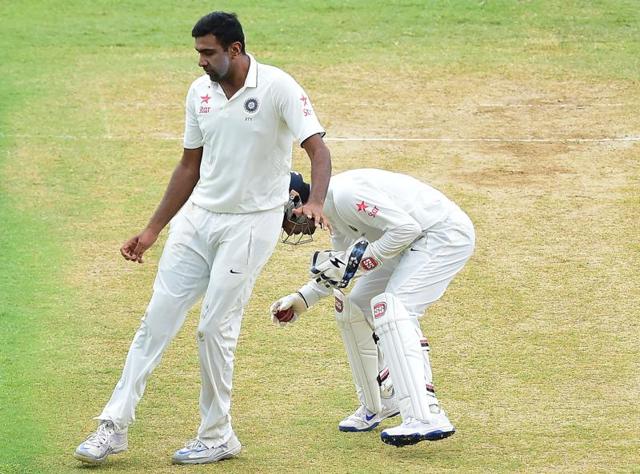 ACTION FIGURE: Ashwin was in the thick of action right through the day, even colliding with ’keeper Saha a little after scalping his fourth victim, Devendra Bishoo, in the 43rd over. (AFP) ACTION FIGURE: Ashwin was in the thick of action right through the day, even colliding with ’keeper Saha a little after scalping his fourth victim, Devendra Bishoo, in the 43rd over. (AFP)